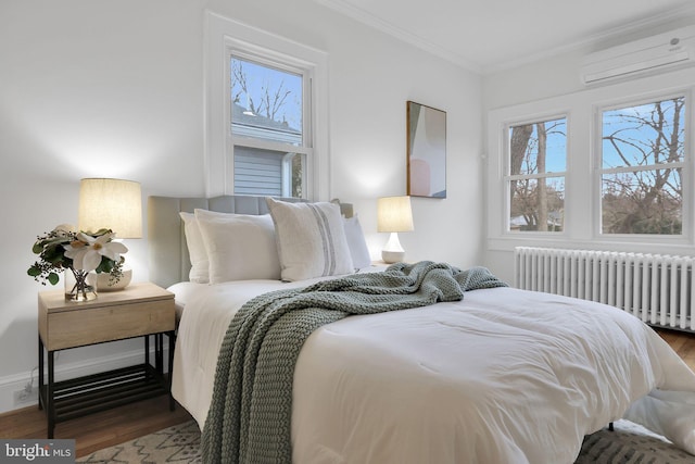 bedroom with crown molding, multiple windows, wood finished floors, and radiator