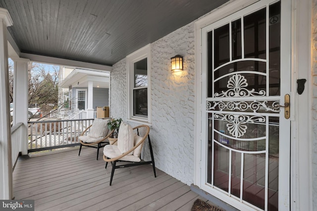 wooden deck featuring covered porch