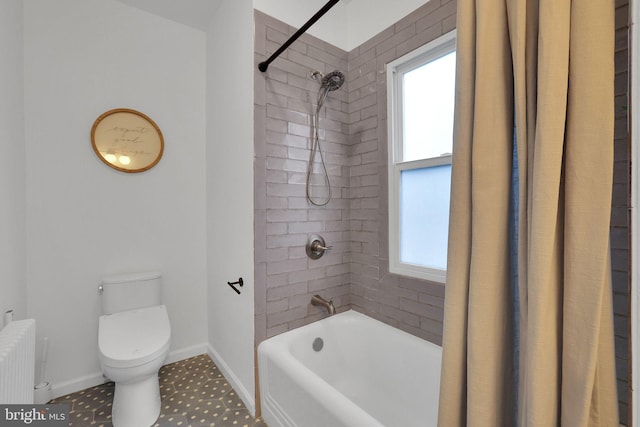 bathroom with radiator, a healthy amount of sunlight, toilet, and shower / bath combo with shower curtain