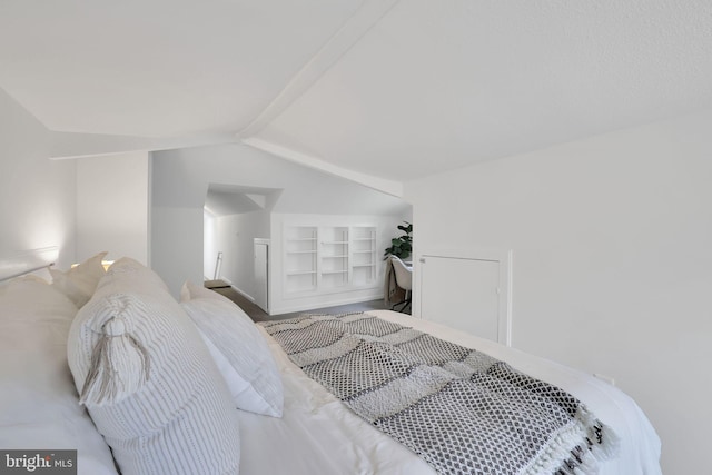 bedroom featuring vaulted ceiling