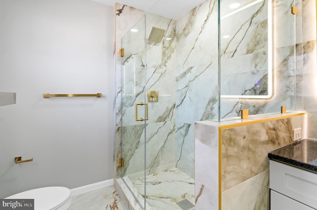 full bath featuring a marble finish shower, baseboards, toilet, marble finish floor, and vanity