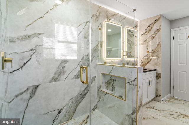 bathroom with marble finish floor, a marble finish shower, and vanity