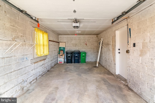 parking garage with a garage door opener and concrete block wall