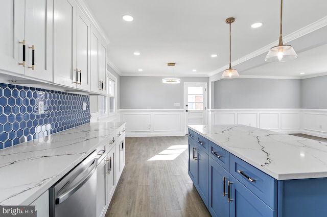 kitchen featuring light wood finished floors, stainless steel dishwasher, ornamental molding, white cabinets, and blue cabinets