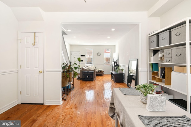 interior space with recessed lighting, baseboards, and wood-type flooring