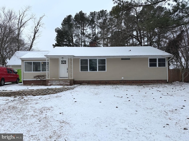 single story home featuring a chimney