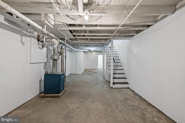 unfinished basement featuring stairway