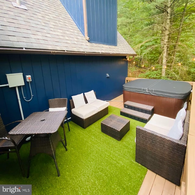 view of patio featuring an outdoor living space and a hot tub