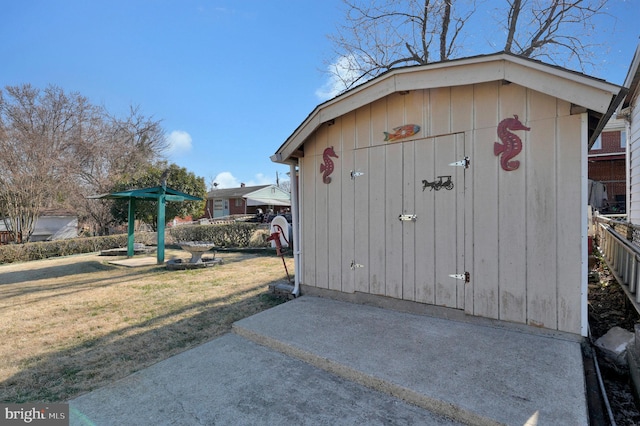 view of shed featuring fence