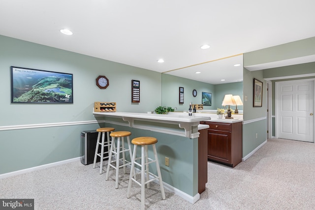bar area with light colored carpet, baseboards, and recessed lighting
