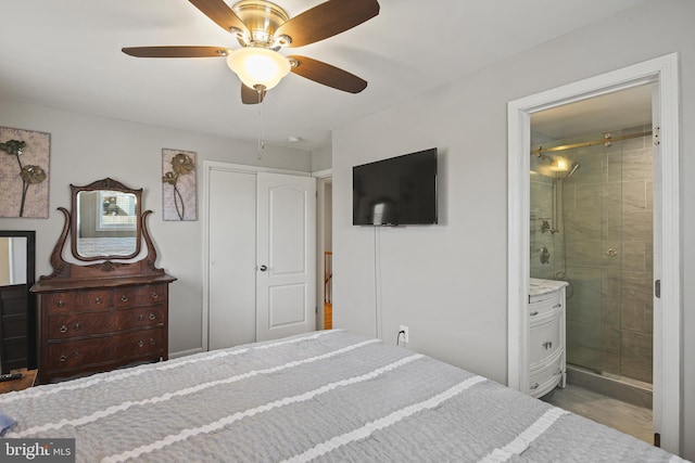 bedroom featuring ensuite bathroom, a ceiling fan, and wood finished floors