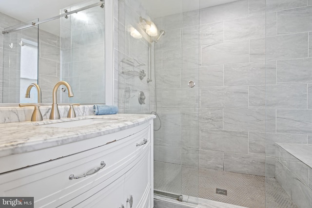 full bath featuring vanity and a stall shower