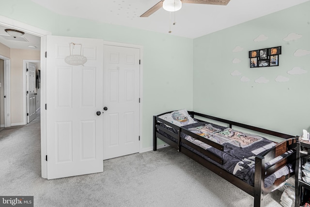 bedroom with baseboards and carpet flooring