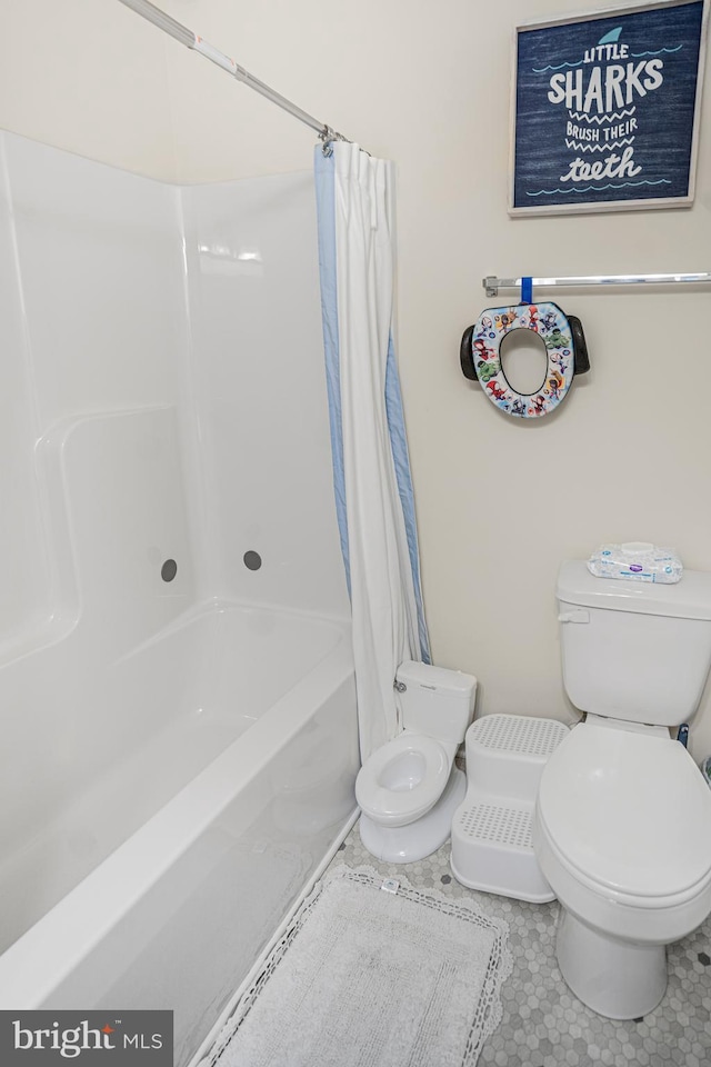 bathroom with shower / bathtub combination with curtain and toilet