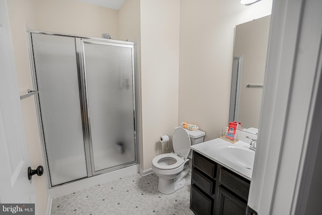 full bath with toilet, a stall shower, and vanity