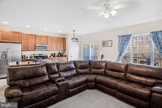 living area with recessed lighting and ceiling fan