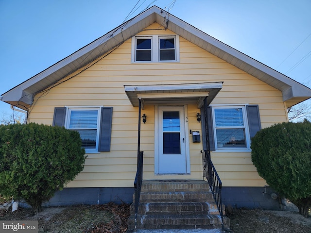 bungalow-style home with entry steps