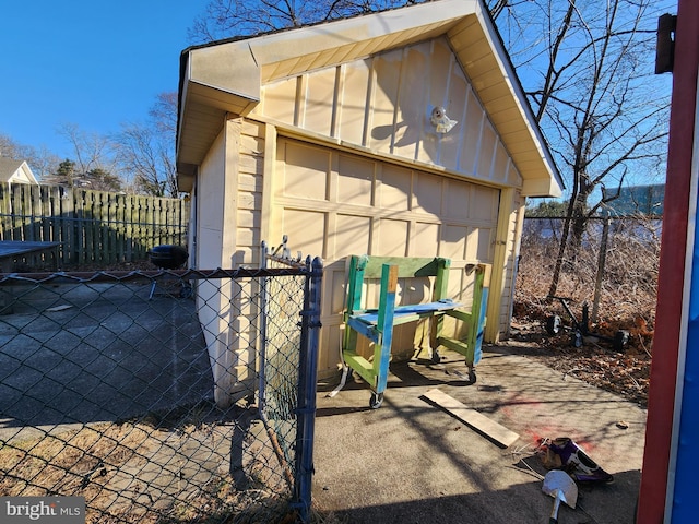 view of outdoor structure with an outbuilding and fence