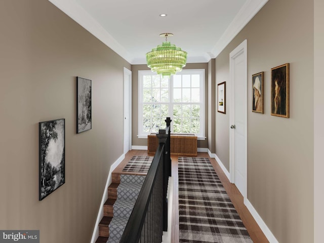 corridor featuring ornamental molding, an inviting chandelier, dark wood finished floors, and baseboards