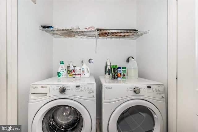 laundry room with washing machine and dryer and laundry area