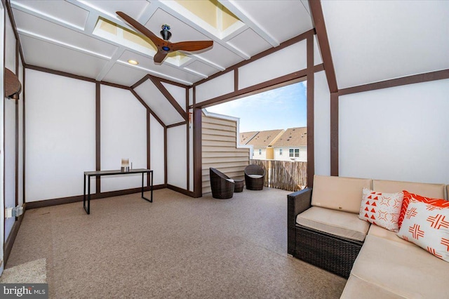 sunroom / solarium featuring a ceiling fan