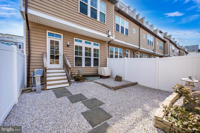 view of patio with a residential view, entry steps, and a fenced backyard