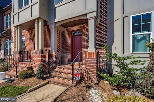 entrance to property with brick siding