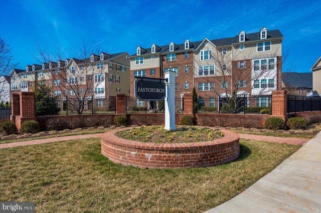 view of building exterior with fence