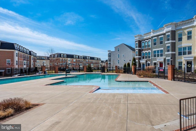 pool featuring a patio area and fence