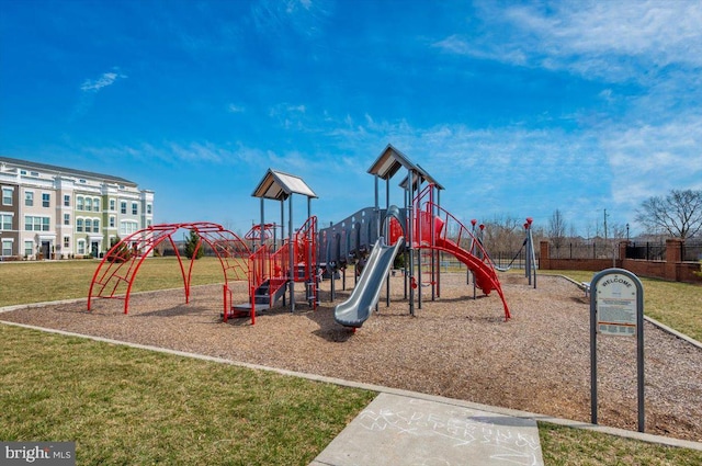 community jungle gym with a lawn