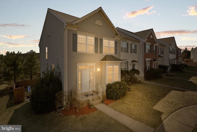 townhome / multi-family property featuring fence