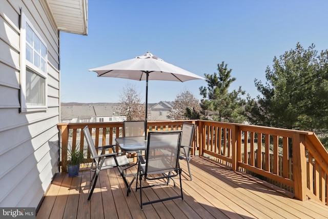 wooden deck featuring outdoor dining space