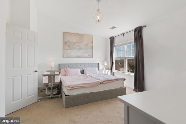 carpeted bedroom featuring a chandelier, visible vents, and lofted ceiling