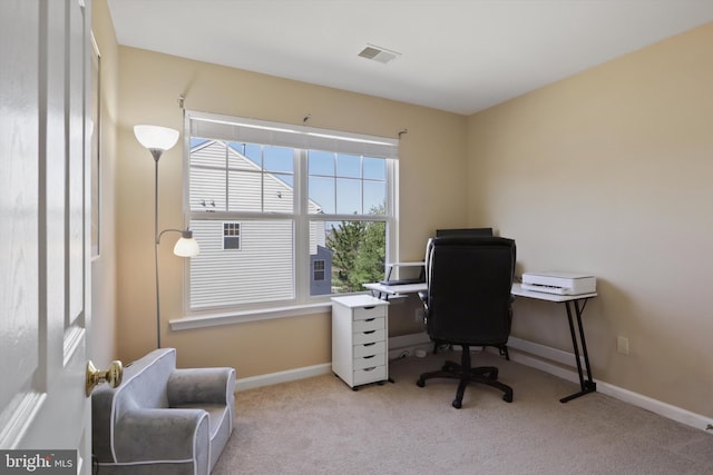 office space with visible vents, baseboards, and carpet