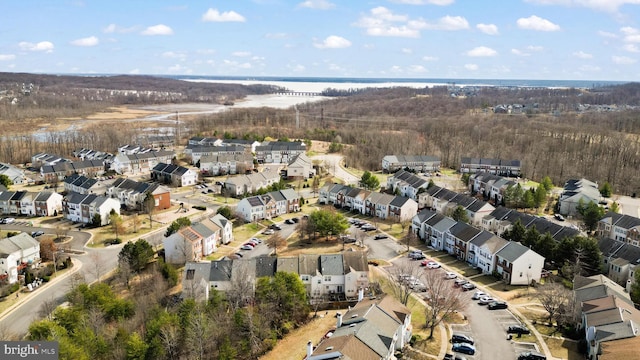 drone / aerial view with a water view and a residential view