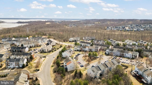 bird's eye view with a residential view and a water view