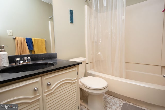 full bath featuring shower / bath combo, vanity, and toilet