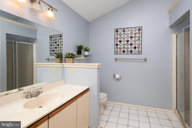 full bathroom featuring a stall shower, vaulted ceiling, vanity, and toilet