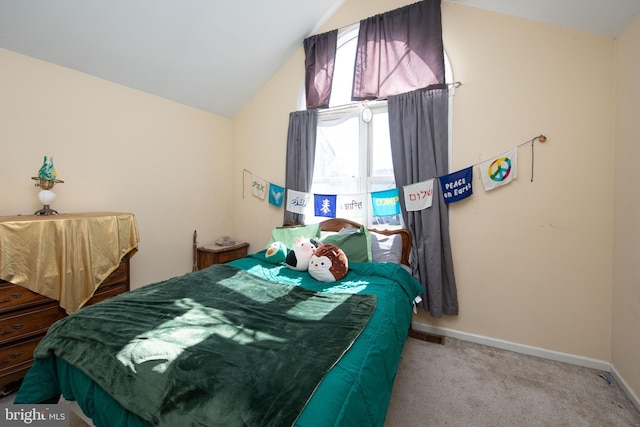 bedroom featuring carpet, lofted ceiling, and baseboards