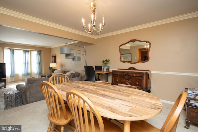 dining area featuring carpet floors, ornamental molding, and a chandelier