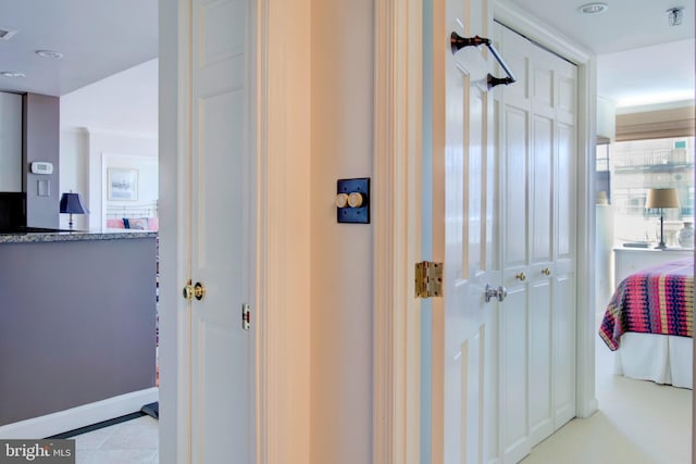 hall with visible vents and tile patterned floors