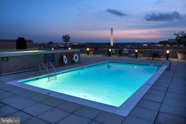 community pool with a patio area