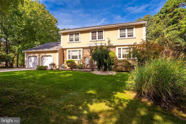 view of front of property with a garage, a front lawn, brick siding, and stucco siding