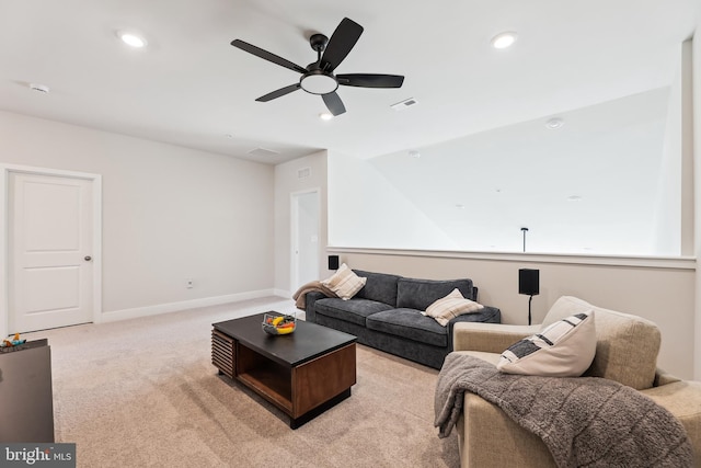 living area featuring visible vents, a ceiling fan, recessed lighting, baseboards, and light colored carpet