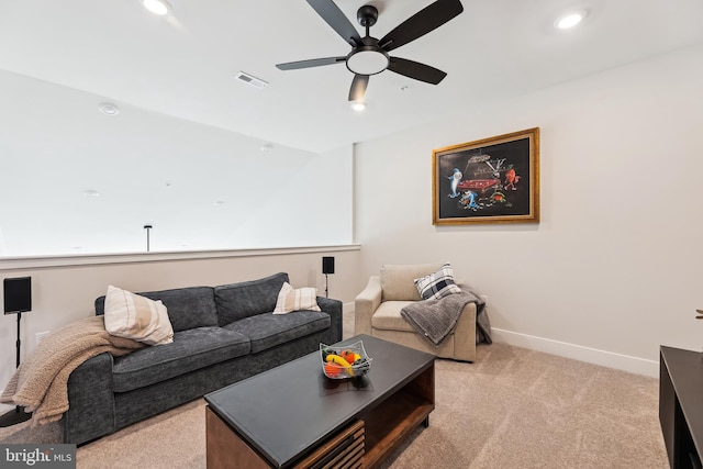 living area with baseboards, visible vents, recessed lighting, ceiling fan, and light carpet