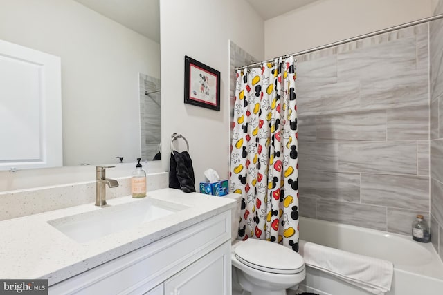 full bath with toilet, vanity, and shower / bathtub combination with curtain