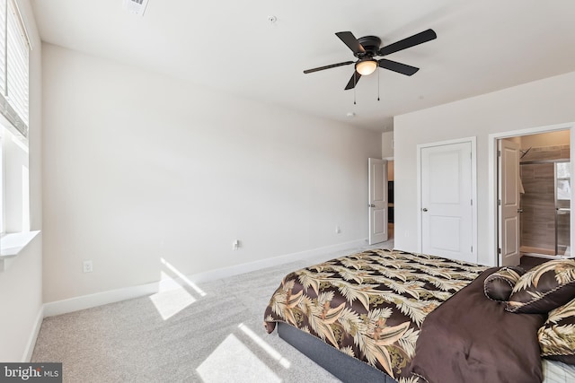 carpeted bedroom featuring a ceiling fan and baseboards