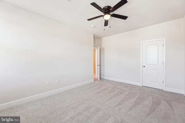 unfurnished bedroom featuring a ceiling fan, carpet, and baseboards