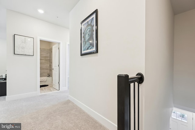 hall with recessed lighting, baseboards, and carpet