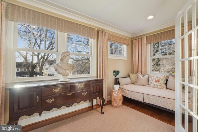 living area featuring recessed lighting, wood finished floors, and ornamental molding